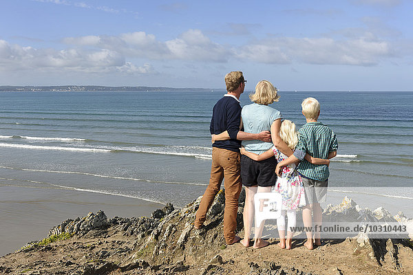 France  Bretagne  Finistere  family with two children looking together at Atlantic