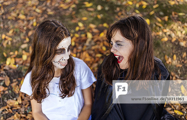 Two masquerade girls at Halloween