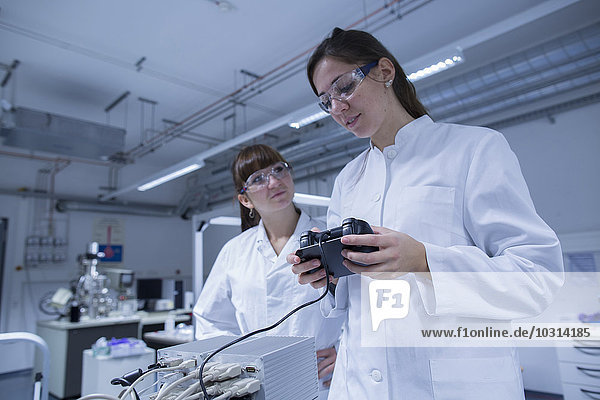 Two female technicans working together in a technical laboratory