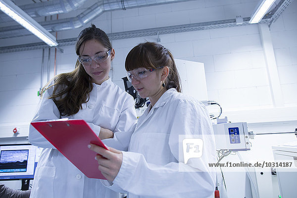 Two female technicans working together in a technical laboratory