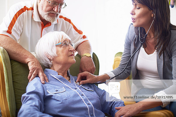 Medic caring for senior woman at home