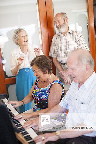 Senior people making music in a retirement village