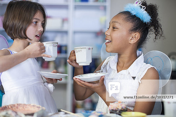 Two girls on a tea party