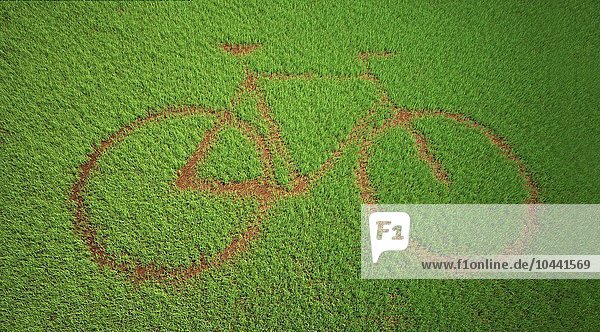 Ein Fahrradsymbol  ausgeschnitten in einem Grasfeld  grüner Transport  konzeptionelles Kunstwerk