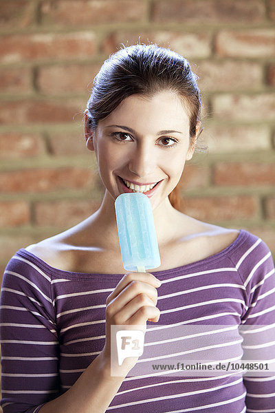 woman eating a popsicle