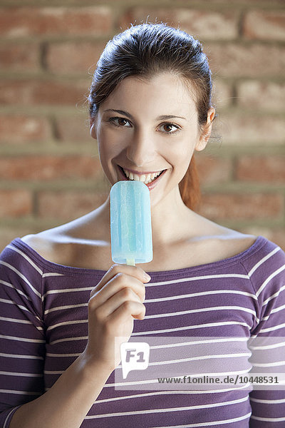 woman eating a popsicle
