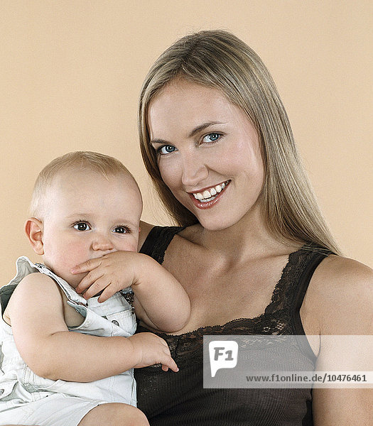 MODEL RELEASED. Mother and baby. He is nine months old. Mother and baby