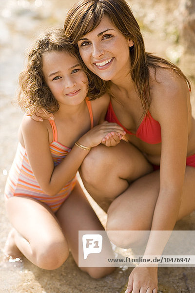 MODEL RELEASED. Mother and daughter at a beach. Mother and daughter