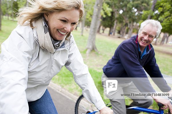 MODEL RELEASED. Senior couple cycling. Senior couple cycling