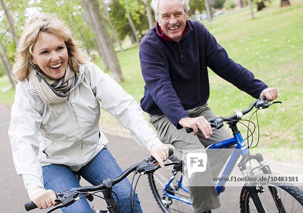MODEL RELEASED. Senior couple cycling. Senior couple cycling