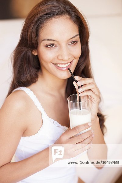 MODEL RELEASED. Woman drinking milk. Woman drinking milk