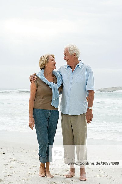 Senior couple standing on a beach