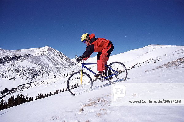 Mountain biker on snow