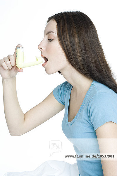 young woman with inhaler