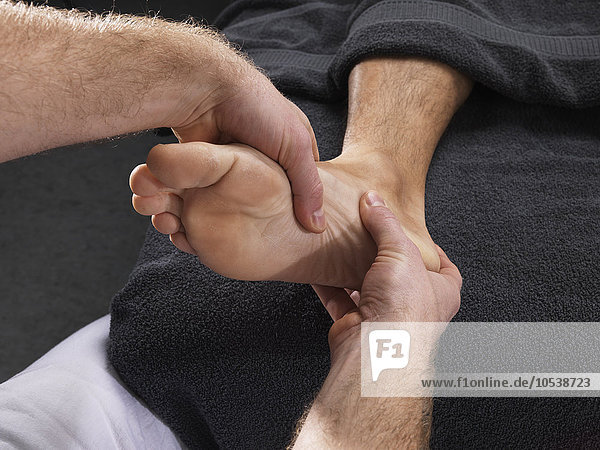 Close up of man having foot massage