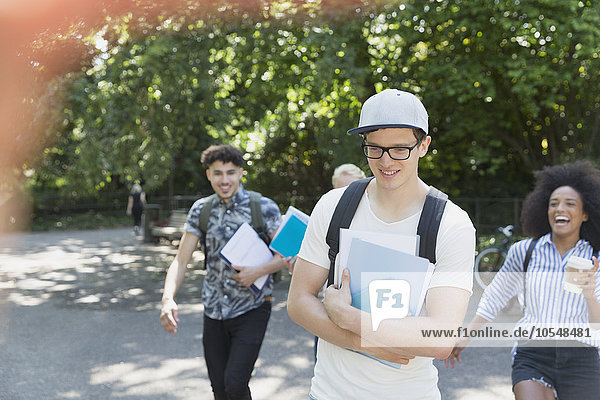 College students walking in park