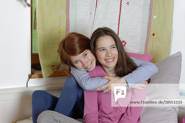 Girls  hugging  friendship  Upper Bavaria Germany
