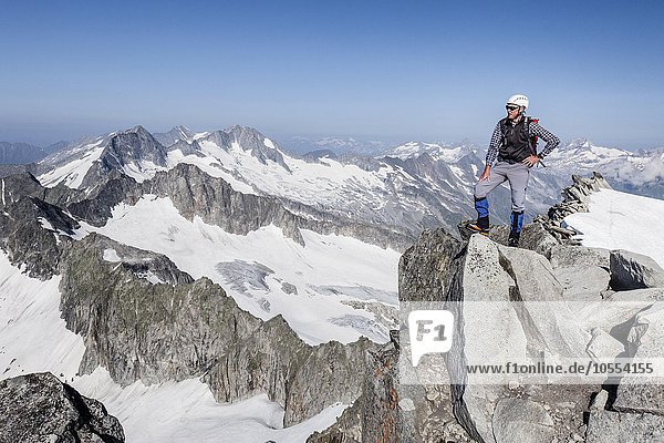 Mountaineer on Schwarzenstein summit ridge  Turnerkamp and Möseler behind  Zillertal Alps  South Tyrol  Trentino-Alto Adige  Italy  Europe