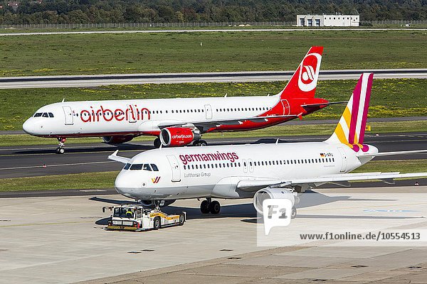 Air Berlin Airbus A321 and German Wings Airbus A320 on the runway  Düsseldorf International airport  Düsseldorf  North Rhine-Westphalia  Germany  Europe