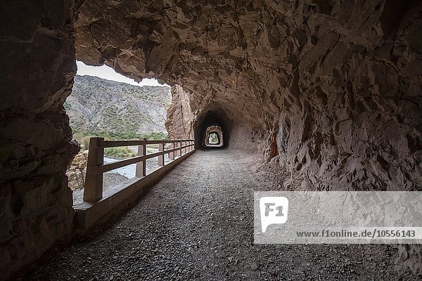 Narrow tunnel through rock road Potosi Bolivia South America
