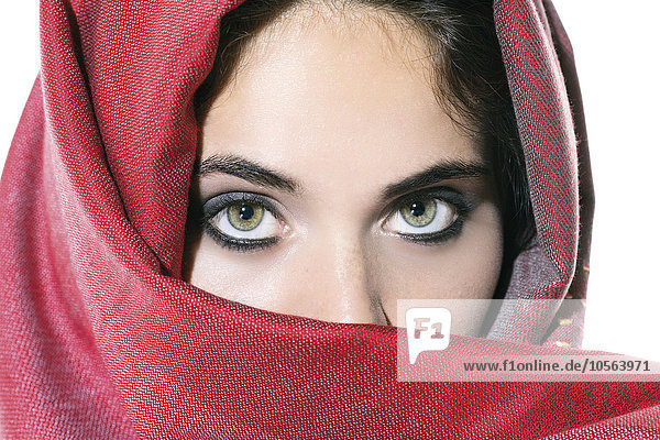 Woman peering over veil