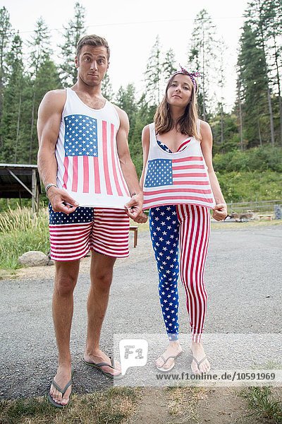 Portrait of couple showing off American flag costume celebrating Independence Day  USA