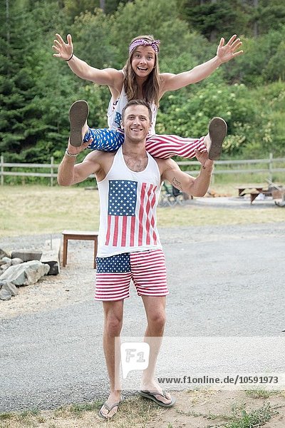 Portrait of couple wearing American flag costume celebrating Independence Day  USA