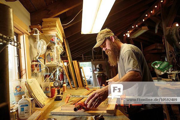 Wood artist working in workshop