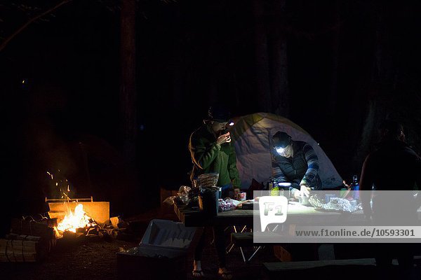 Hikers preparing dinner at camp
