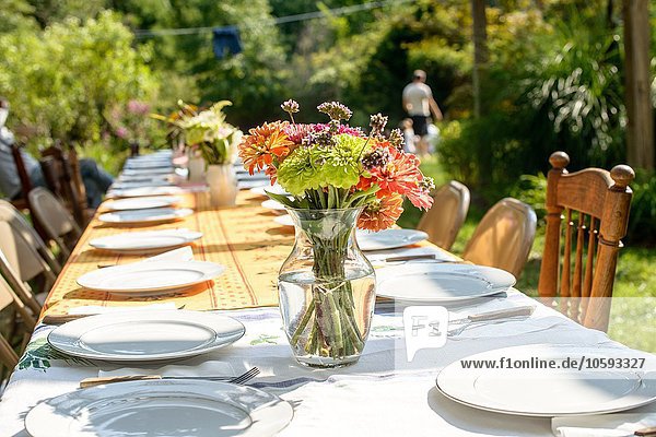 Table setting for large family at tomato eating festival