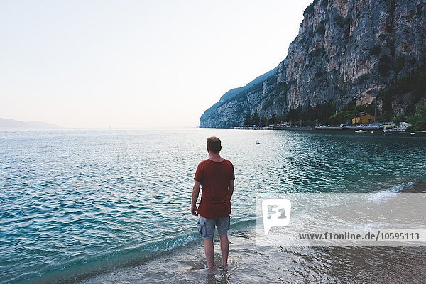Man enjoying view of Lake Garda  Italy
