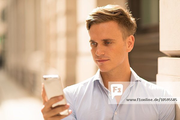 Man texting in street  close up