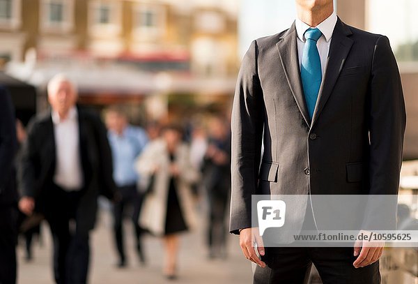 Businessman in suit  partially obscured  London  UK