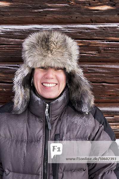 Happy woman in fur hat