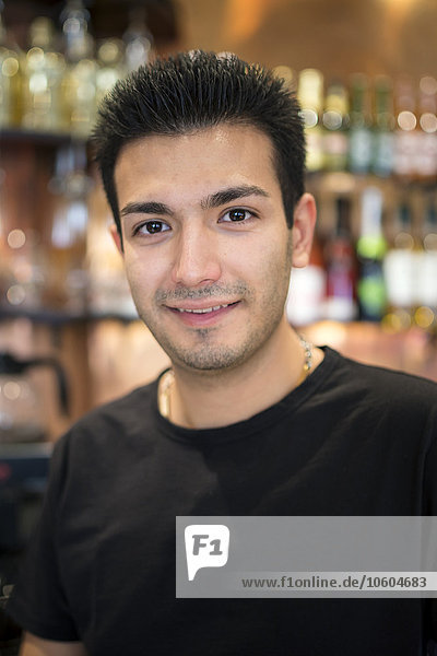 Portrait of young man in bar