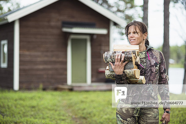 Woman carrying firewood