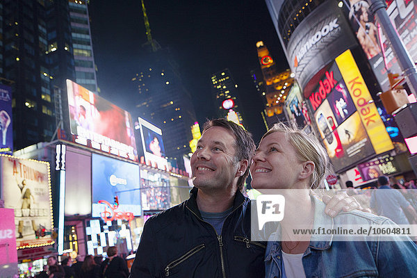 Couple at Times Square at night  New York City  USA