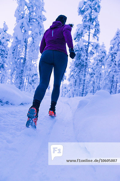 Woman running at winter