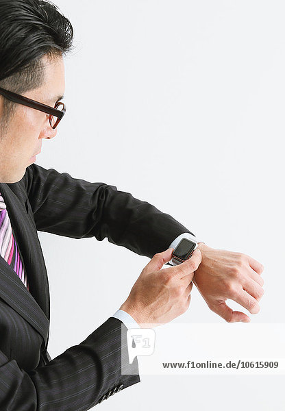 Japanese businessman with wearable smart watch