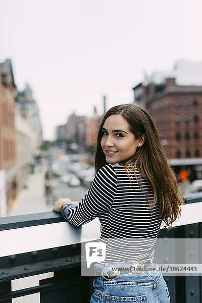 USA  New York City  portrait of smiling brunette young woman
