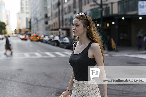 USA  New York City  young woman on the go in Manhattan