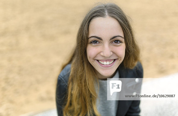 Portrait of smiling teenage girl outdoors