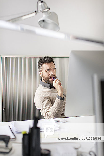 Man in office sitting at desk
