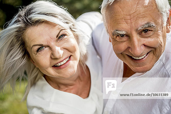 Portrait of happy elderly couple outdoors