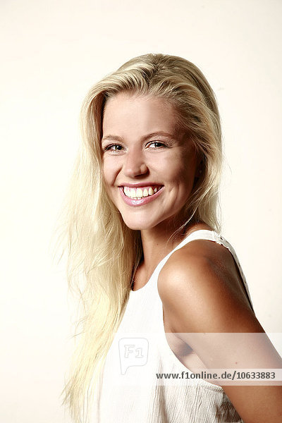 Portrait of smiling blond young woman
