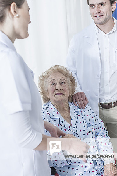 Doctor and nurse with elderly patient