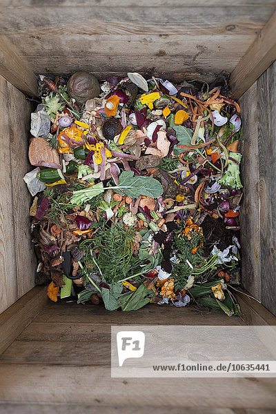 Directly above shot of vegetable waste in wooden container