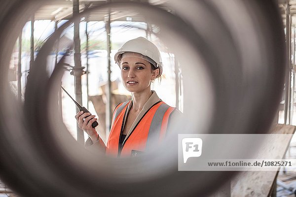 Portrait of female builder on construction site