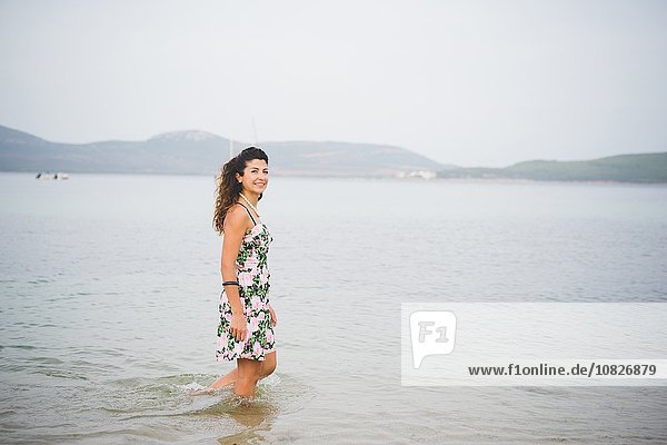 Woman standing in sea  Alghero  Sassari  Sardinia  Italy