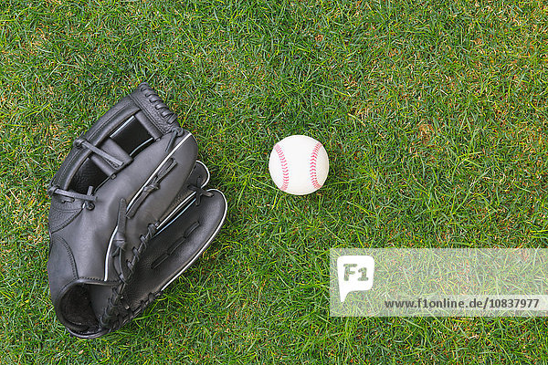 Baseball equipment on grass